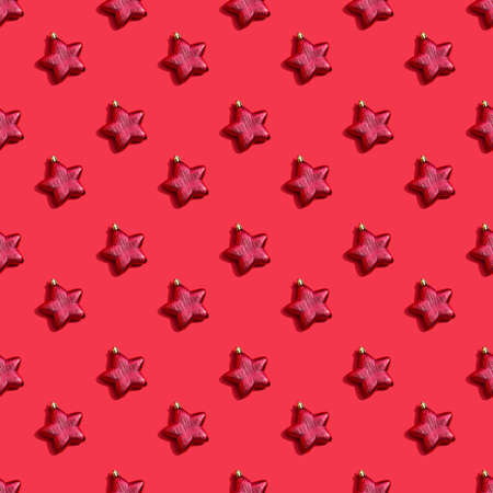 Minimal pattern background of red star on red background. New Year concept. flat lay top view squareの写真素材