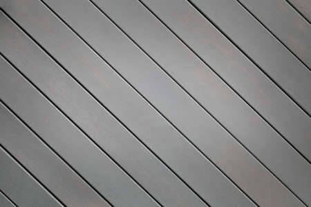 Gray wooden background with diagonal lines. Board background with copy space. Textured wooden...