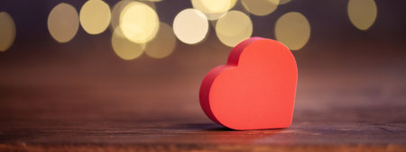 Red heart on wooden background with bokeh, valentine day greeting card. selective focus, banner, copy spaceの写真素材