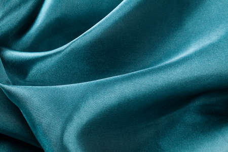 blue silk fabric with waves, elegant wallpaper design, abstract backgroundの写真素材