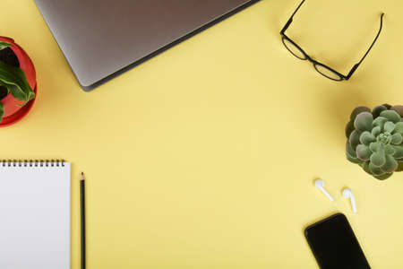 office table desk, workspace with notebook, mobile phone, computer, green plant, coffee and...