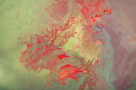 yellow, green and red abstract paint background, texture art. marble background.floating colored ink on water.の写真素材