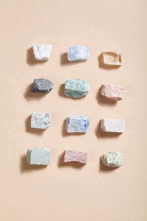 many crystal minerals on beige background. magic rock for crystal ritual, witchcraft, spiritual...