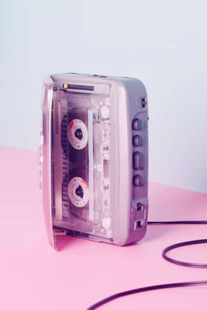 Old audio player with cassette on neon color. retro style. vintage music conceptの写真素材