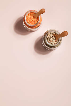 Vegan protein source. lentils in glass jar on beige background. Healthy vegetarian food. copy spaceの写真素材