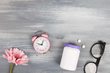 women health concept. medicine, health care style. copyspace. white plastic bottle with pills,...