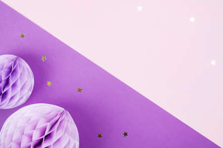 Purple Scandinavian modern paper honeycomb decoration on purple background.Concept of happiness, joy, birthday, party, advertisement, copy spaceの写真素材