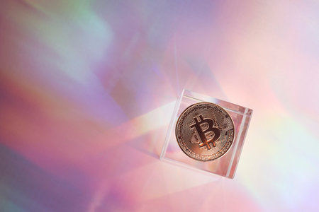 Golden bitcoin coin on holographic, abstract, neon background. digital currency, business style. Mining and trade bitcoin concept.の写真素材
