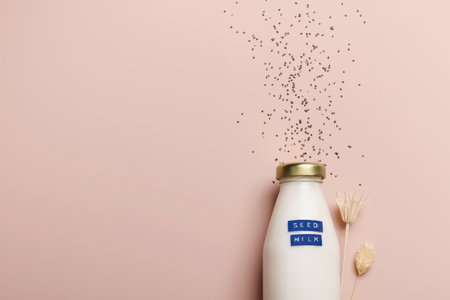 chia seed milk in bottle on beige background with plant. copyspace. Raw diet meal. Healthy vegetarian food and lifestyle. eco friendlyの写真素材