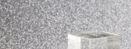 transparent podium for product display on silver glittering background. pedestal, stage for product. copy space. selective focusの写真素材