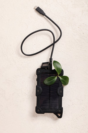 cheapest source of electricity. power box, portable solar battery for phone on white background. innovative solutions concept. copy spaceの写真素材