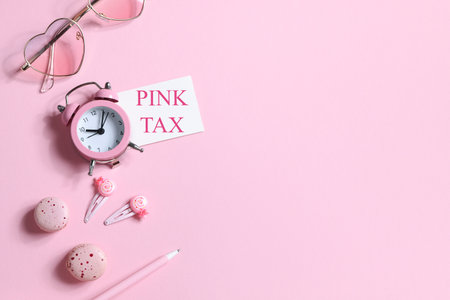 pink tax concept. watches, glasses, hairpins, pen and macaroons in pink colors. copyspace. items for womenの写真素材
