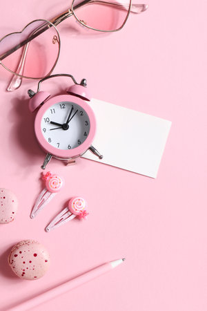 watches, glasses, hairpins, pen and macaroons in pink colors. copyspace. items for women. frame, mockup copyspace. party for girls. relax conceptの写真素材