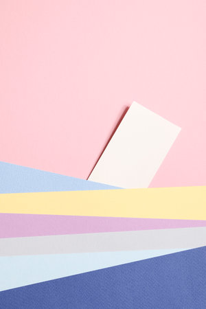 holiday concept. card for invitation, anniversary, birthday party. frame, mockup copyspace. colorful papers on pink background.の写真素材