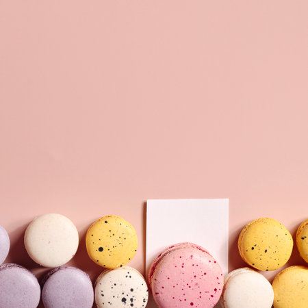 Holiday concept. card for invitation, anniversary , birthday party. frame, mockup copy space. colorful macaroons on beige background. squareの写真素材