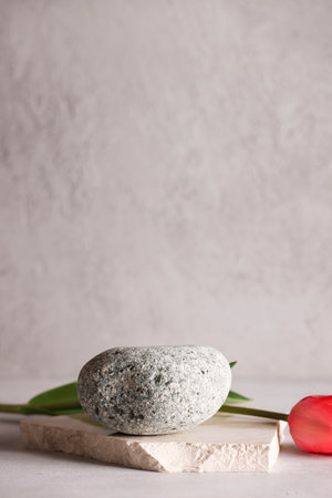 Minimal background for branding and product presentation.natural stone for product display on grey background.copy space.advertising and sale conceptの写真素材