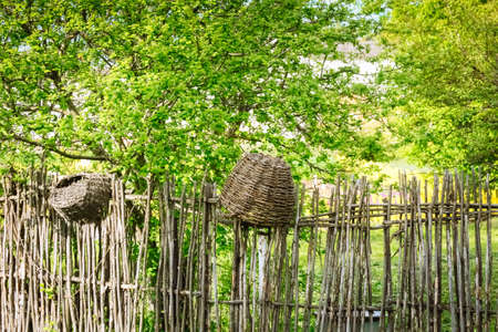Spring Fence from woven rods and branches Basketの写真素材