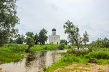 Sunny spring landscape. White church on the river, in the countryside. Natureの写真素材
