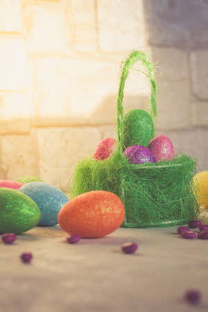 Easter scene with colored eggs - Image vertical, indoorsの写真素材