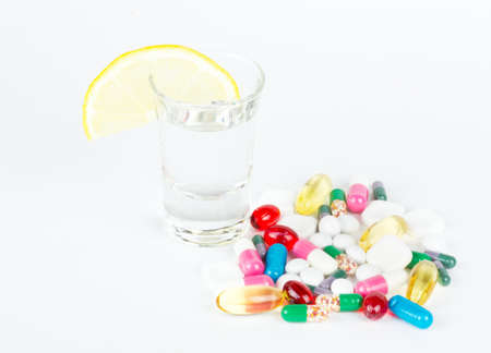 alcohol and tablets on whiteの写真素材
