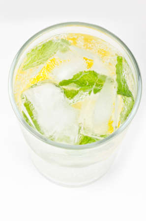 Healthy club soda with lemon and mint on whiteの写真素材