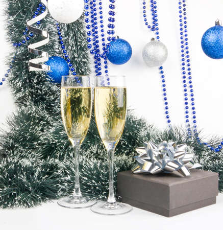 Christmas composition with champagne and present in blue color on whiteの写真素材
