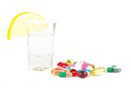 alcohol and tablets on whiteの写真素材