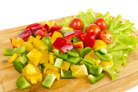 Fresh pepper cuts with cherry tomatoes on white backgroundの写真素材