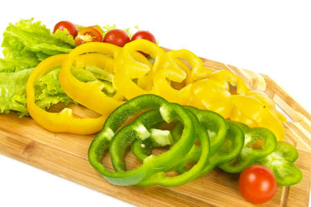 Fresh pepper sliced with cherry tomatoes on white backgroundの写真素材