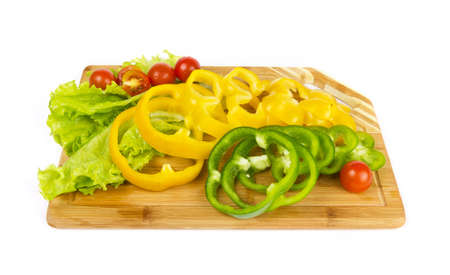 Fresh pepper sliced with cherry tomatoes on white backgroundの写真素材