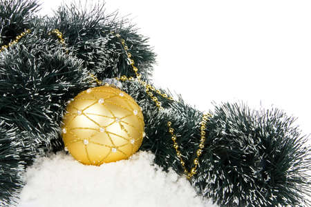 Christmas composition with golden ball and snowの写真素材