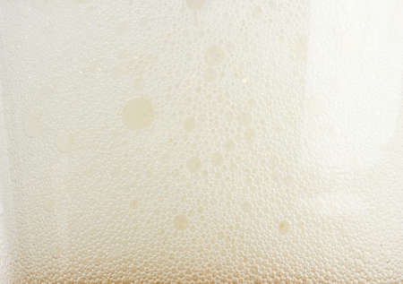 Lager light beer foam backgroundの写真素材