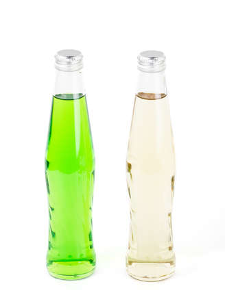 Two lemonade bottles on whiteの写真素材