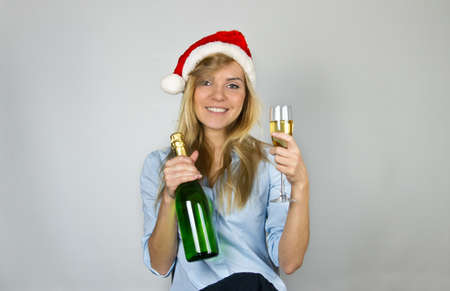 Young pretty young woman with Christmas champagne