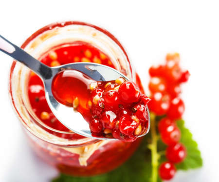 Red currant berry jam with spoonの写真素材
