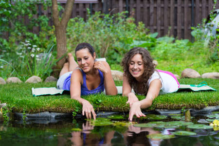 Two beautiful young brunet woman outdoorsの写真素材