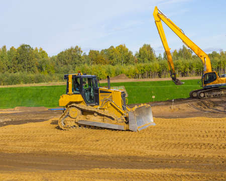 Yellow Construction Excavator at Workの写真素材