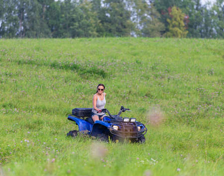Elegant woman riding extreme quadrocycleの写真素材