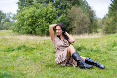Elegant attractive woman riding a horseの写真素材