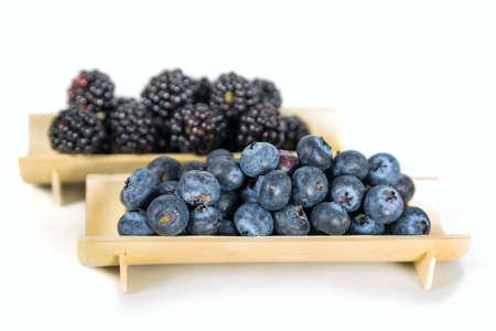Blueberry and blackberries on white
