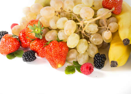 mix of fruits strawberries grapes blackbrries bananaの写真素材