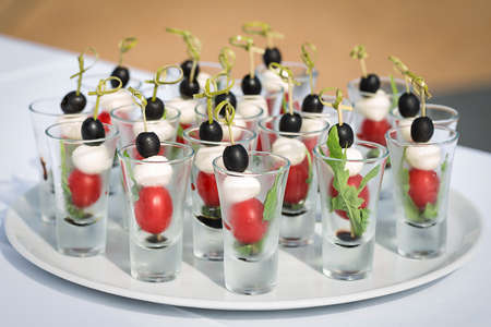 mozzarella olive tomato canape fresh  light snackの写真素材