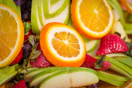 Fruit plate orange apple grapes strawberries mint