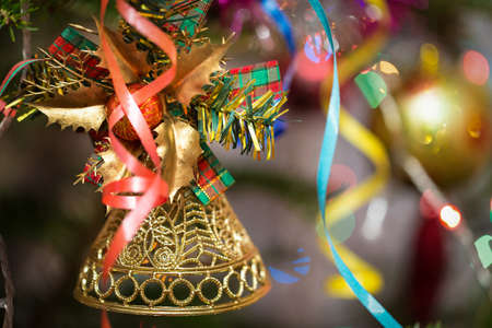 Christmas bell on a branchの写真素材