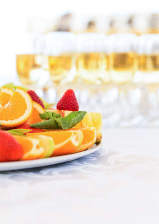 Banquet fruit plate with champagne glassesの写真素材