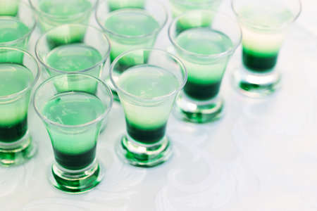 Raw of green mint shot drinks for partyの写真素材