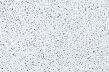 Water drops on a transparent window backgroundの写真素材
