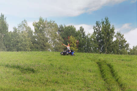 Elegant woman riding quadrocycleの写真素材