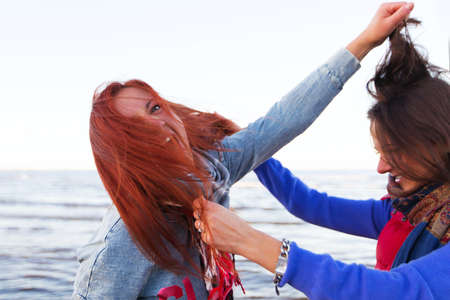 Fighting women near lake