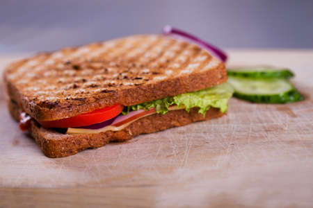 Fresh homemade grilled sandwich on wood